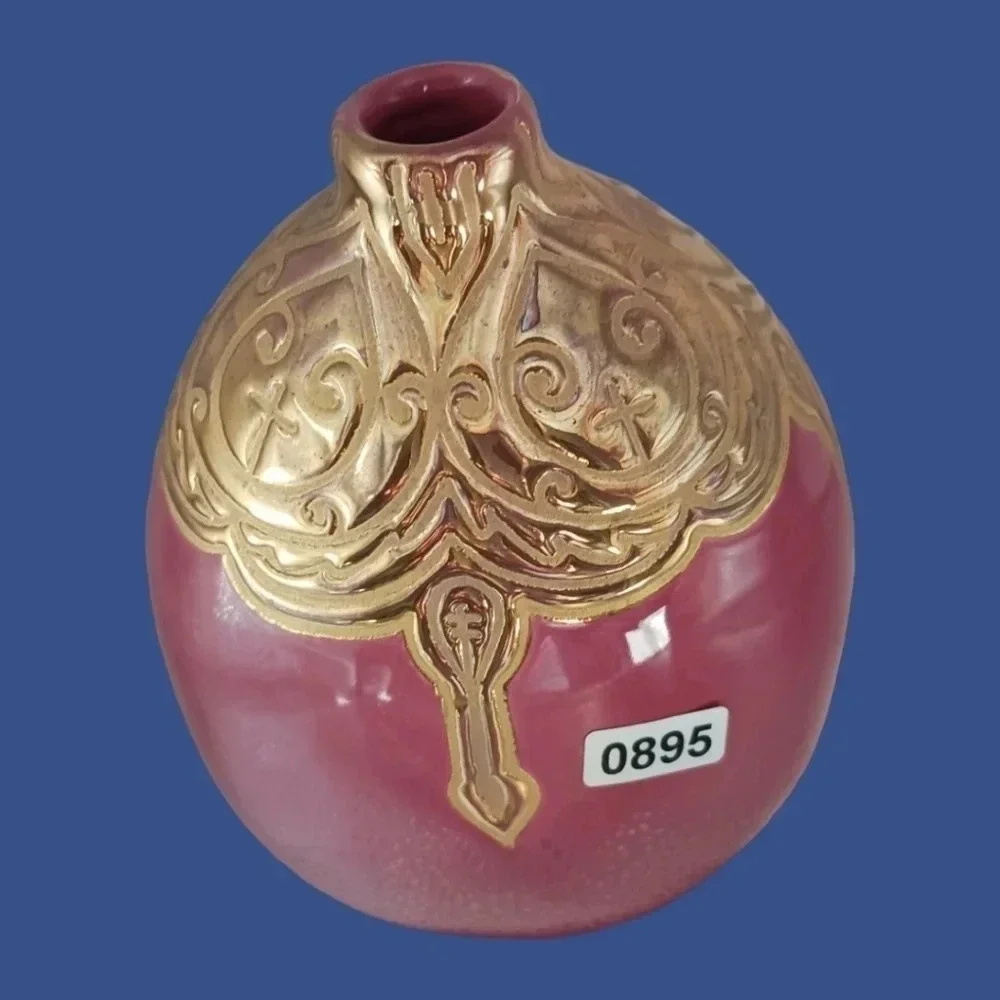 Vintage ceramic engraved  vase topped with enameled gold glazed